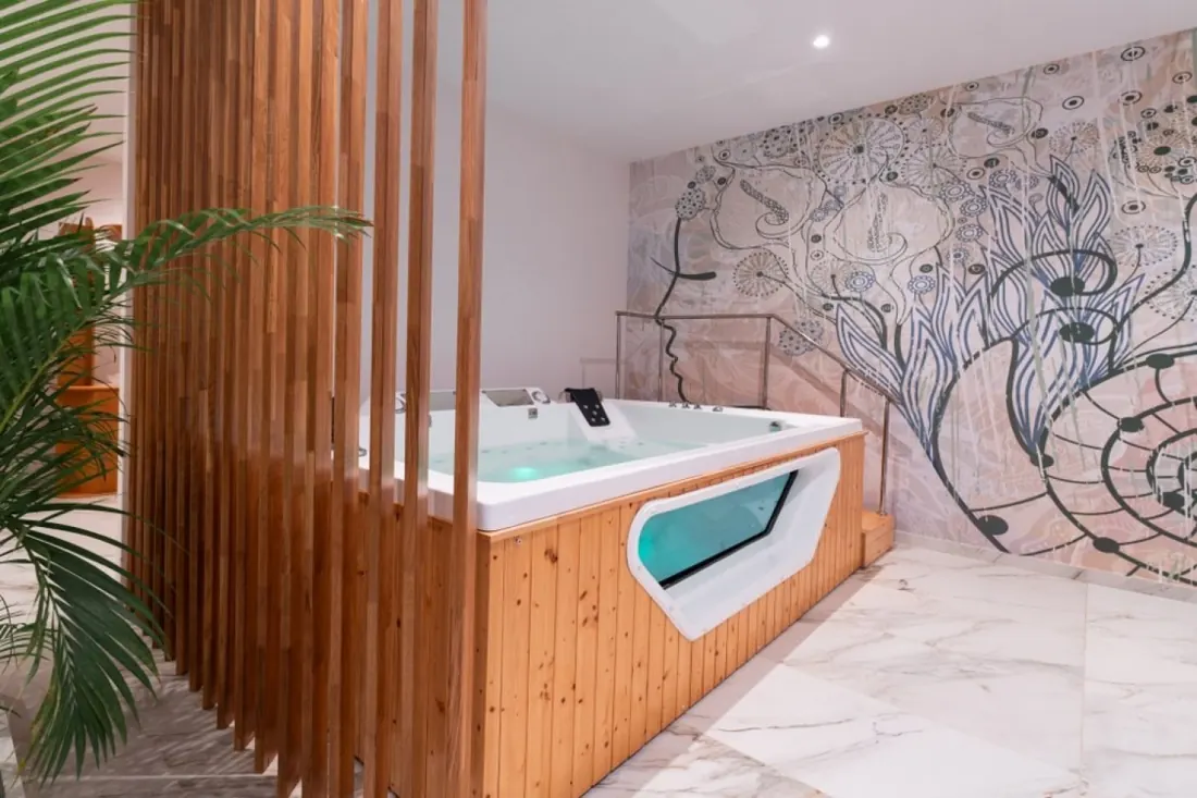 A treatment room with a hydrotherapy bath at the spa